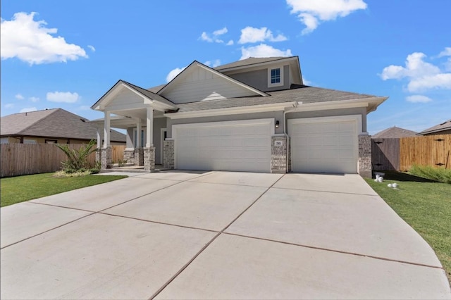 246 Salt Springs Rd, Kyle, TX 78640 - view of front of property featuring a garage and concrete driveway