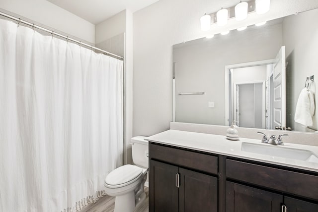 11 Bent Trail Ln, Georgetown, TX 78628 - full bath with toilet, vanity, wood finished floors, and a shower with curtain