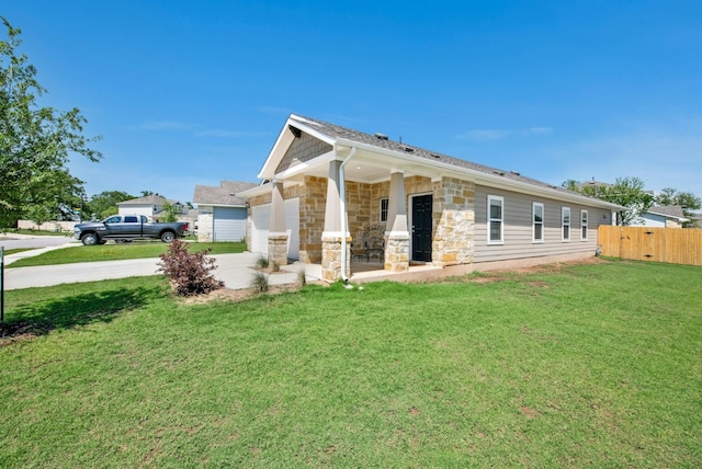11 Bent Trail Ln, Georgetown, TX 78628 - view of front of property featuring driveway, an attached garage, and stone siding