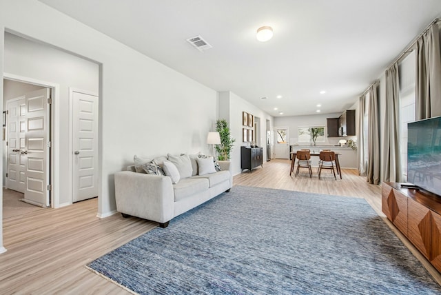 11 Bent Trail Ln, Georgetown, TX 78628 - living area with light wood-type flooring, recessed lighting, and baseboards