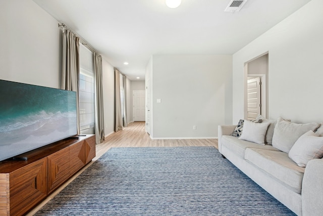 11 Bent Trail Ln, Georgetown, TX 78628 - living room featuring light wood-type flooring, baseboards, and recessed lighting