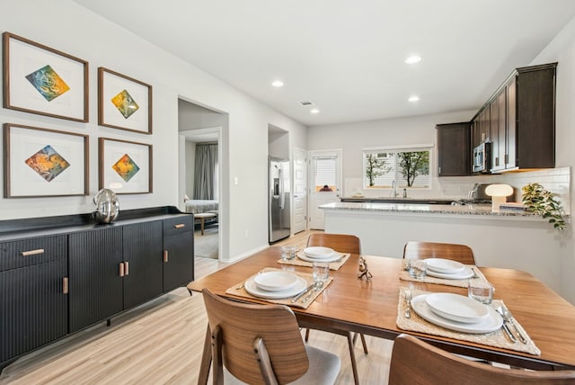 11 Bent Trail Ln, Georgetown, TX 78628 - dining space featuring light wood-style floors and recessed lighting