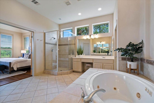 209 Steamboat Xing, Dripping Springs, TX 78620 - bathroom featuring connected bathroom, a stall shower, a whirlpool tub, tile patterned flooring, and recessed lighting