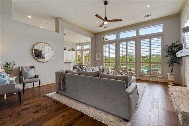209 Steamboat Xing, Dripping Springs, TX 78620 - living room featuring crown molding, ceiling fan, dark wood-style flooring, baseboards, and recessed lighting
