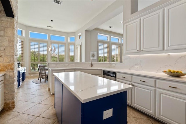 209 Steamboat Xing, Dripping Springs, TX 78620 - kitchen featuring a sink, a center island, dishwasher, white cabinets, and light tile patterned floors
