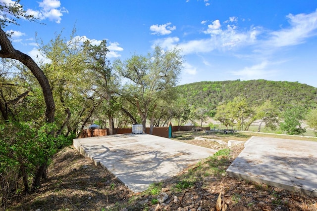 13451 Bullick Hollow Rd, Austin, TX 78726 - view of yard featuring fence and a mountain view