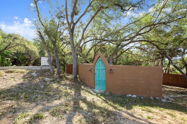 13451 Bullick Hollow Rd, Austin, TX 78726 - fenced front yard featuring a gate
