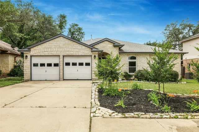1603 Country Squire Dr, Cedar Park, TX 78613 - view of front of property with a garage, concrete driveway, stone siding, central air condition unit, and a shingled roof
