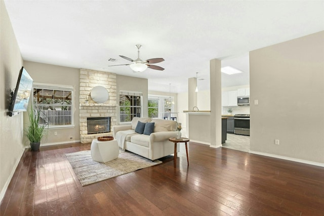 1603 Country Squire Dr, Cedar Park, TX 78613 - living room with hardwood / wood-style flooring, ceiling fan, and baseboards