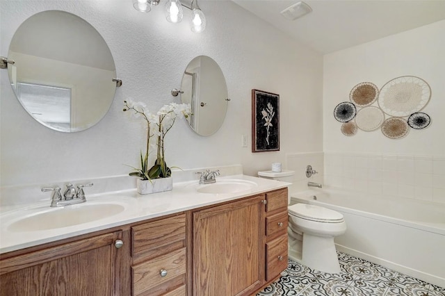 227 Woodlake Dr, Georgetown, TX 78633 - full bath with double vanity, a bathtub, and tile patterned flooring