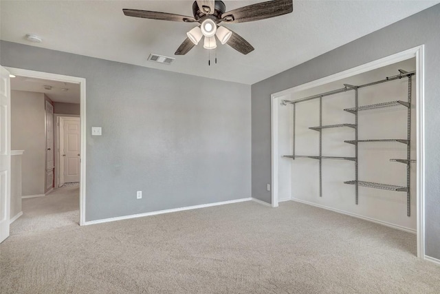227 Woodlake Dr, Georgetown, TX 78633 - unfurnished bedroom with carpet, a closet, and ceiling fan