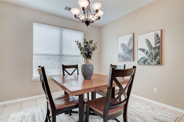 227 Woodlake Dr, Georgetown, TX 78633 - dining room featuring a chandelier and light tile patterned floors