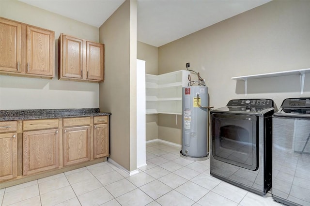 227 Woodlake Dr, Georgetown, TX 78633 - washroom featuring water heater, independent washer and dryer, cabinet space, and light tile patterned floors