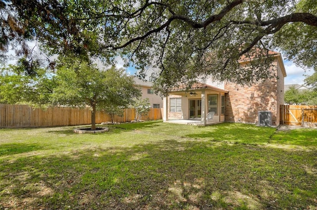 227 Woodlake Dr, Georgetown, TX 78633 - fenced backyard with ceiling fan, a patio area, and a gate