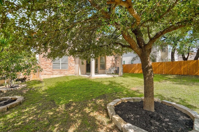 227 Woodlake Dr, Georgetown, TX 78633 - fenced backyard featuring a patio area