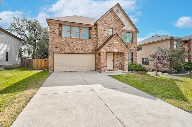 227 Woodlake Dr, Georgetown, TX 78633 - traditional-style house with brick siding, a garage, and driveway