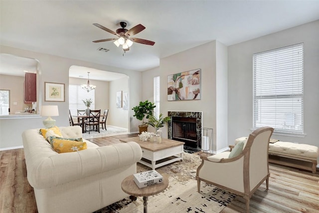 227 Woodlake Dr, Georgetown, TX 78633 - living room with wood finished floors, healthy amount of natural light, and ceiling fan