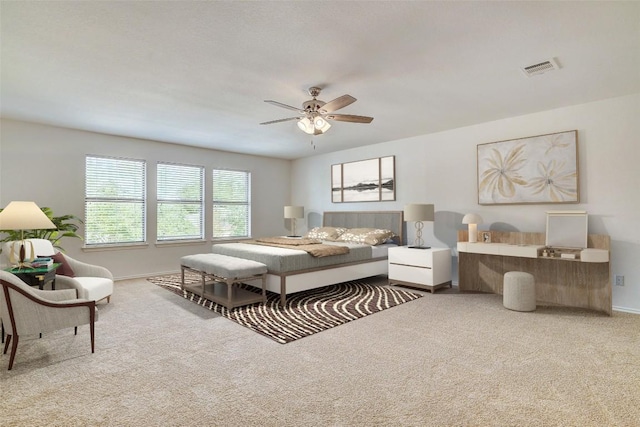 227 Woodlake Dr, Georgetown, TX 78633 - carpeted bedroom with baseboards and a ceiling fan