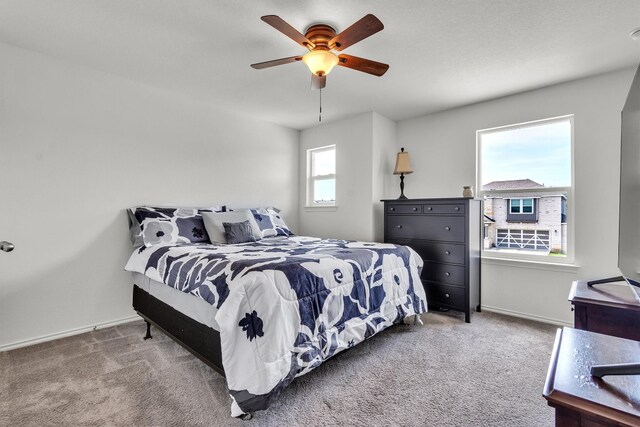 282 Crimson Ln, Kyle, TX 78640 - carpeted bedroom featuring baseboards and a ceiling fan