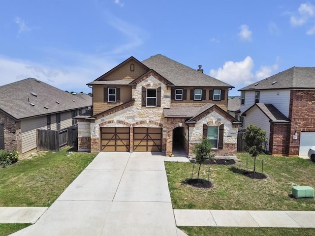 282 Crimson Ln, Kyle, TX 78640 - french country inspired facade with stone siding, driveway, an attached garage, and roof with shingles