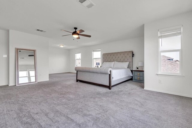 282 Crimson Ln, Kyle, TX 78640 - bedroom with carpet floors, ceiling fan, and baseboards