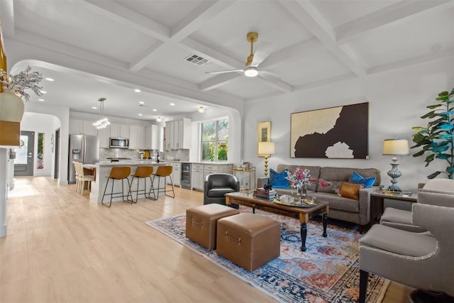 286 Stone View Trl, Austin, TX 78737 - living room with coffered ceiling, a ceiling fan, beverage cooler, light wood finished floors, and recessed lighting