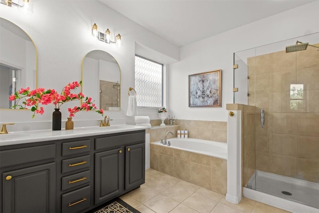 286 Stone View Trl, Austin, TX 78737 - bathroom featuring tile patterned flooring, a shower stall, a garden tub, and double vanity