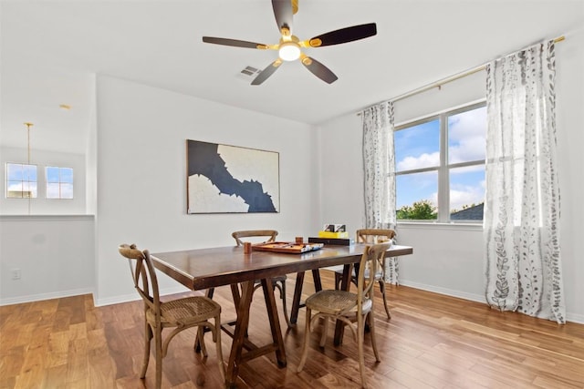 286 Stone View Trl, Austin, TX 78737 - dining area featuring wood finished floors, healthy amount of natural light, and a ceiling fan