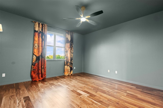 286 Stone View Trl, Austin, TX 78737 - spare room featuring wood finished floors, ceiling fan, and baseboards