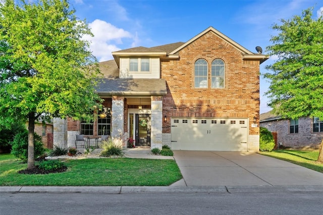286 Stone View Trl, Austin, TX 78737 - traditional-style home featuring an attached garage, driveway, a front lawn, brick siding, and roof with shingles