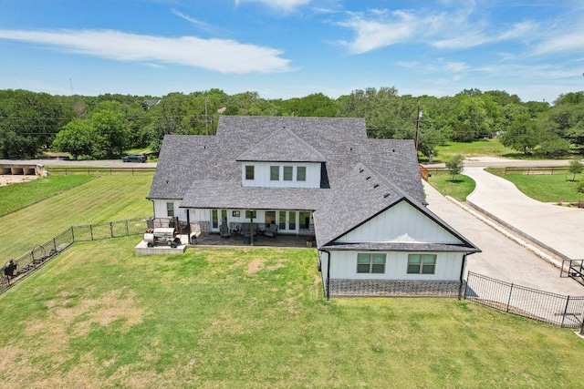 795 Van Bibber Rd, Salado, TX 76571 - back of house featuring a shingled roof, a patio area, and board and batten siding