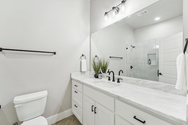 795 Van Bibber Rd, Salado, TX 76571 - full bathroom featuring toilet, a tile shower, vanity, and baseboards