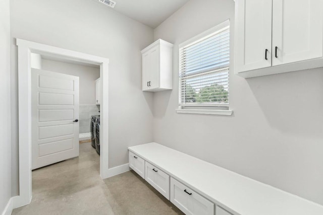 795 Van Bibber Rd, Salado, TX 76571 - mudroom featuring concrete flooring, washer and clothes dryer, and baseboards