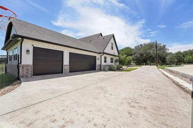 795 Van Bibber Rd, Salado, TX 76571 - view of property exterior with concrete driveway, fence, an attached garage, and roof with shingles