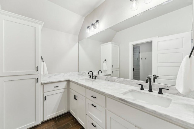 795 Van Bibber Rd, Salado, TX 76571 - full bathroom featuring wood finished floors and double vanity