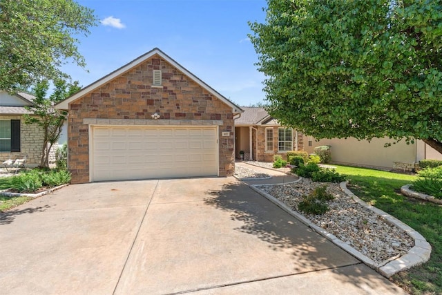 403 Dove Hollow Trl, Georgetown, TX 78633 - single story home featuring a garage, driveway, and stone siding