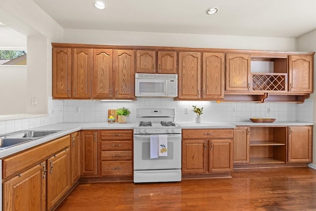 403 Dove Hollow Trl, Georgetown, TX 78633 - kitchen featuring white appliances, light countertops, open shelves, dark wood-type flooring, and recessed lighting