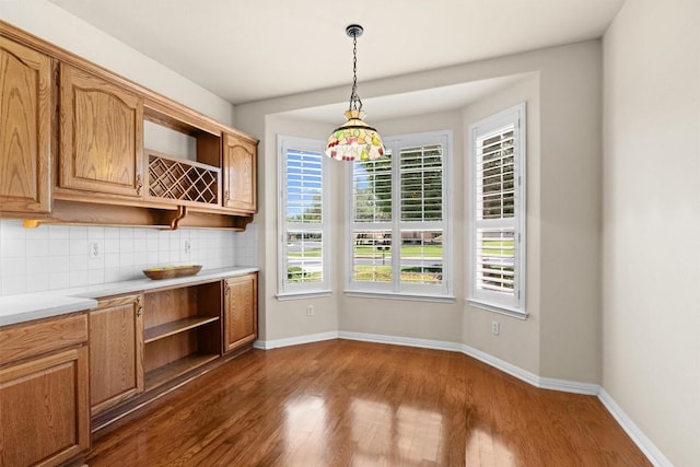 403 Dove Hollow Trl, Georgetown, TX 78633 - unfurnished dining area with dark wood-style flooring and baseboards
