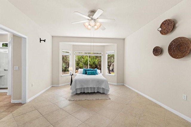 403 Dove Hollow Trl, Georgetown, TX 78633 - bedroom with light tile patterned floors, ceiling fan, and baseboards