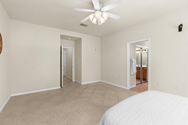403 Dove Hollow Trl, Georgetown, TX 78633 - unfurnished bedroom with light tile patterned flooring, ensuite bath, and a ceiling fan