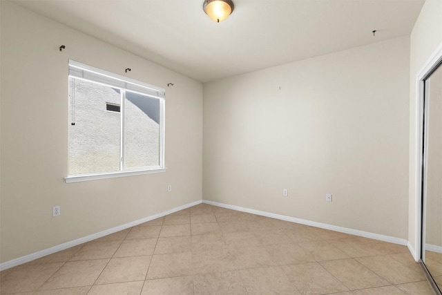 403 Dove Hollow Trl, Georgetown, TX 78633 - unfurnished room with plenty of natural light, baseboards, and light tile patterned floors