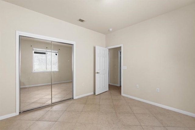 403 Dove Hollow Trl, Georgetown, TX 78633 - unfurnished bedroom with light tile patterned flooring and a closet
