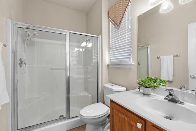 403 Dove Hollow Trl, Georgetown, TX 78633 - bathroom with a shower stall, vanity, and toilet