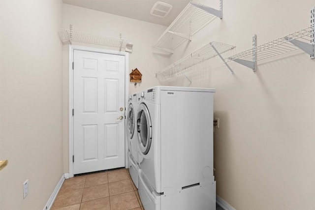 403 Dove Hollow Trl, Georgetown, TX 78633 - laundry area with washer and clothes dryer and light tile patterned floors