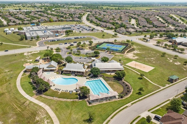 aerial view of property and surrounding area featuring a pool area