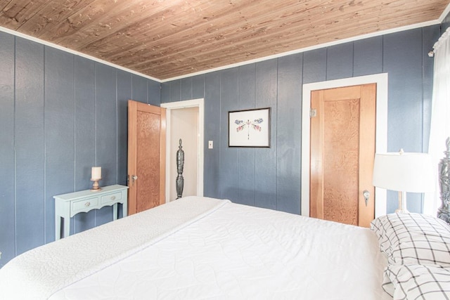 1408 W Clark St, Bartlett, TX 76511 - bedroom featuring wood ceiling, wooden walls, and ornamental molding