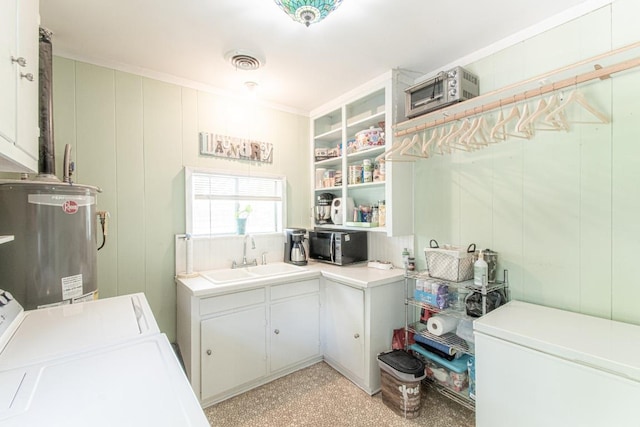 1408 W Clark St, Bartlett, TX 76511 - laundry area featuring independent washer and dryer, water heater, and a decorative wall
