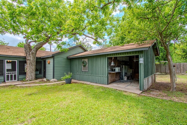 1408 W Clark St, Bartlett, TX 76511 - ranch-style house featuring board and batten siding, roof with shingles, and a garage