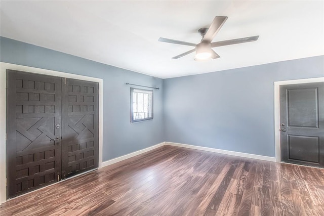 1408 W Clark St, Bartlett, TX 76511 - unfurnished bedroom featuring wood finished floors, baseboards, and ceiling fan