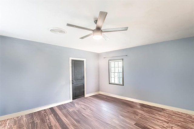 1408 W Clark St, Bartlett, TX 76511 - unfurnished room featuring dark wood finished floors, a ceiling fan, and baseboards